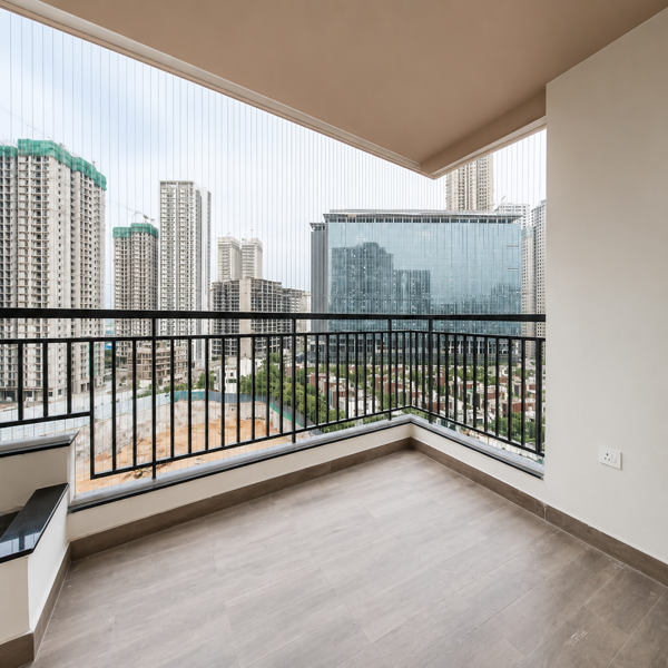 Modern balcony, spacious balcony, luxury apartment, apartment balcony, contemporary home, high rise apartment, city view, skyline view, urban landscape, panoramic view, balcony railing, black metal railing, glass windows, open balcony, covered balcony, large balcony, spacious terrace, residential apartment, premium property, luxury real estate, modern architecture, city buildings, skyscrapers, high rise buildings, urban skyline, modern cityscape, outdoor living space, balcony flooring, tiled floor, grey flooring, neutral interior, bright balcony, natural light, airy space, elegant apartment, contemporary design, minimalist balcony, clean space, residential property, apartment exterior, scenic view, elevated view, city residence, modern home, balcony enclosure, safety railing, spacious outdoor area, urban lifestyle, real estate photography, premium apartment, modern living.
